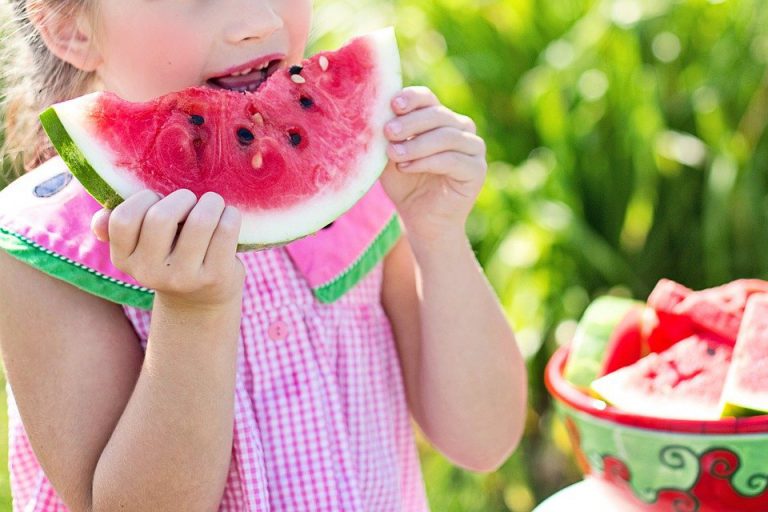 Little girl enjoying a watermelon