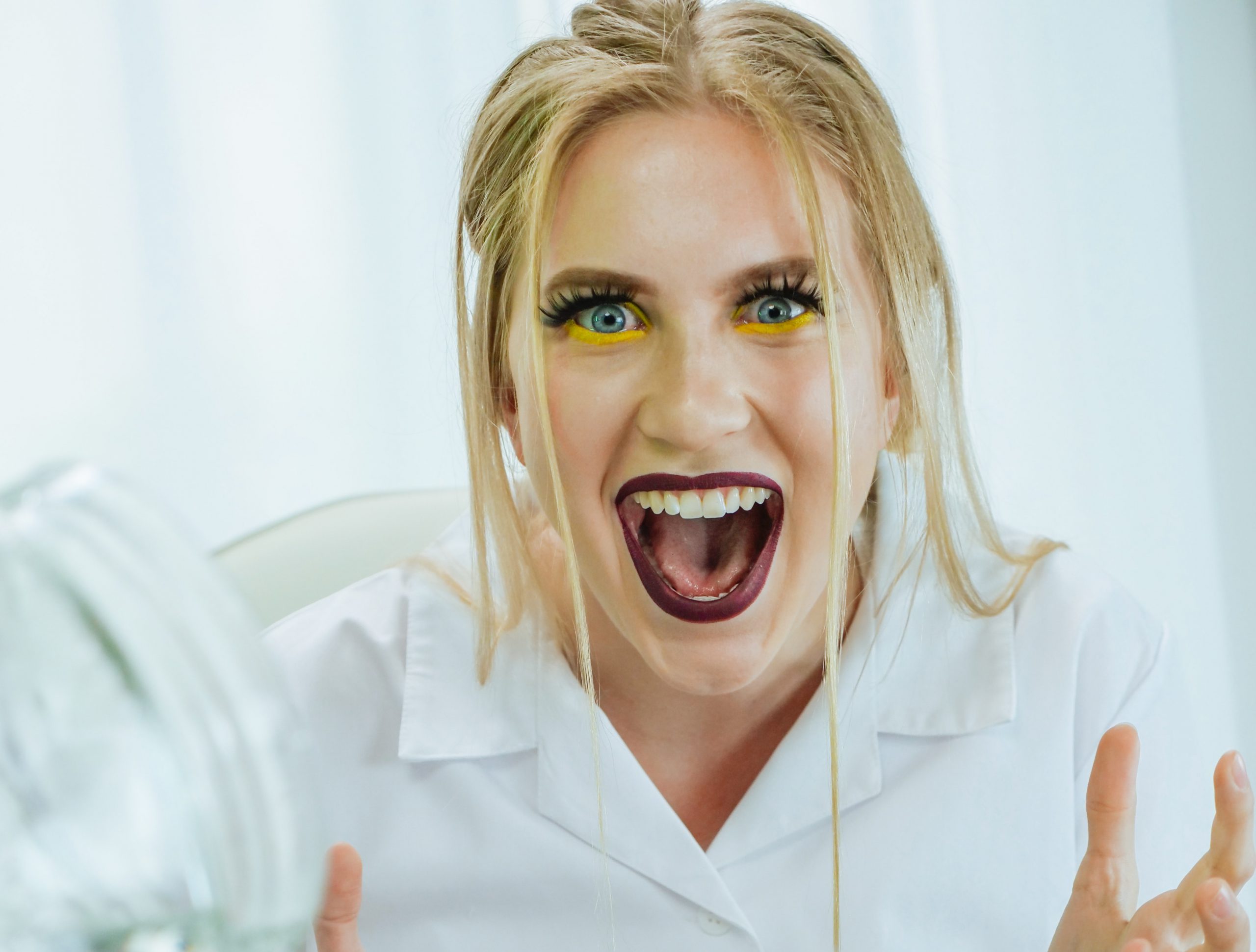 Surprised female biotechnologist with creative make up