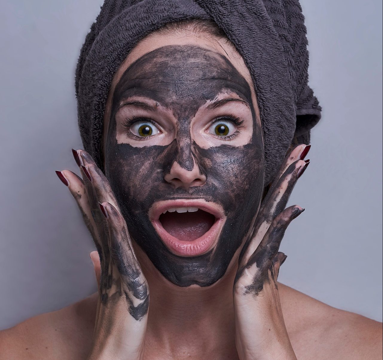 Woman with cosmetic face mask - Source: Unsplash