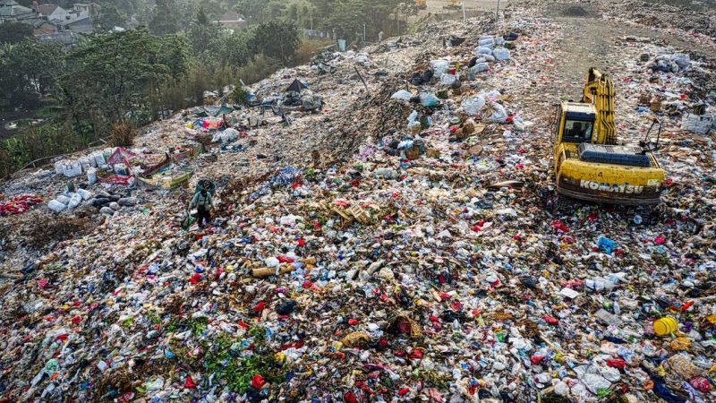 Drone shot of a landfill with a lot of plastic waste in Indonesia.