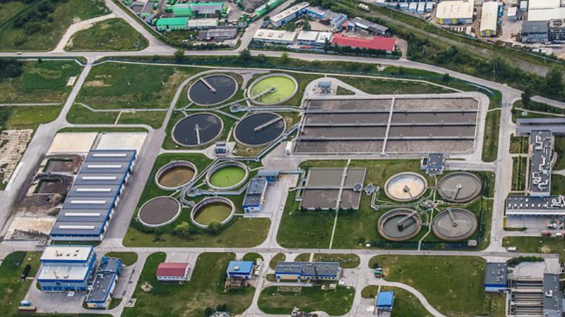 Aerial view of a wastewater treatment plant with several clarifiers.